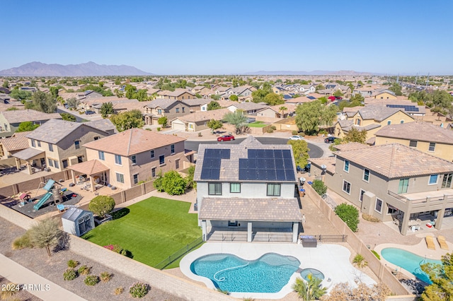 birds eye view of property featuring a mountain view