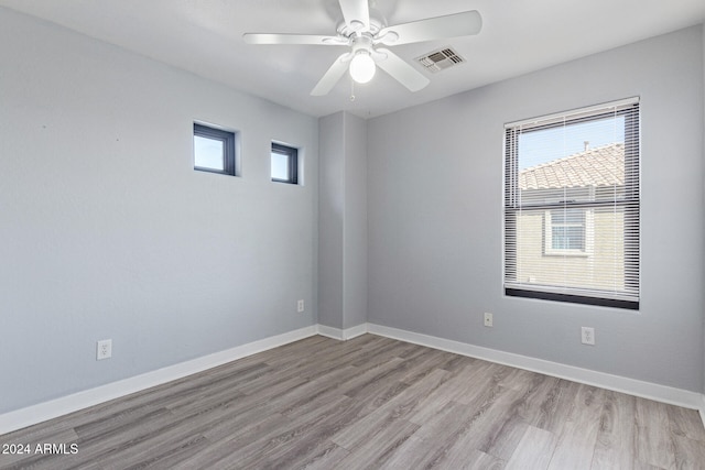 unfurnished room with light hardwood / wood-style flooring and ceiling fan