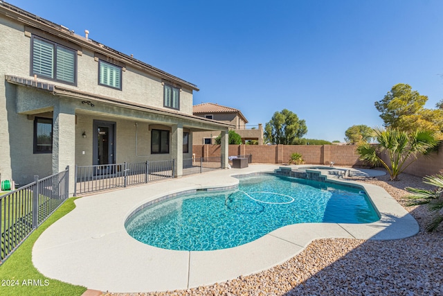 view of swimming pool featuring a patio area