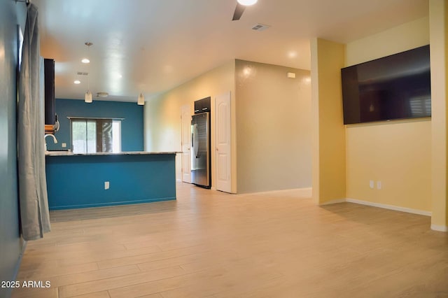 728 S Meadowood Ln, Sierra Vista, AZ 85635 - unfurnished living room featuring light wood-type flooring, ceiling fan, baseboards, and recessed lighting