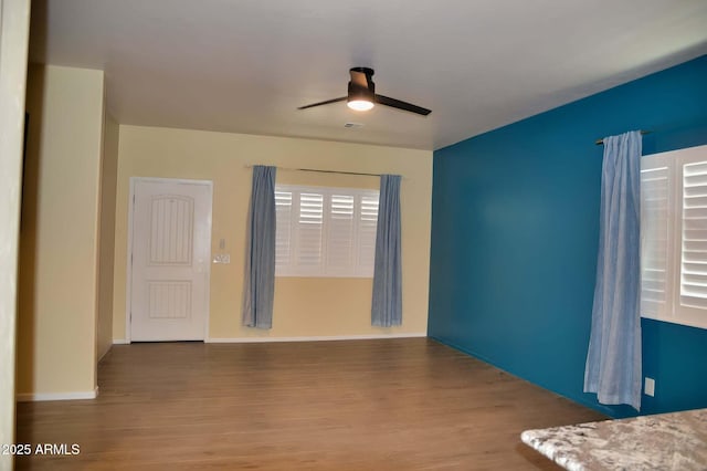 728 S Meadowood Ln, Sierra Vista, AZ 85635 - empty room with wood finished floors, ceiling fan, and baseboards