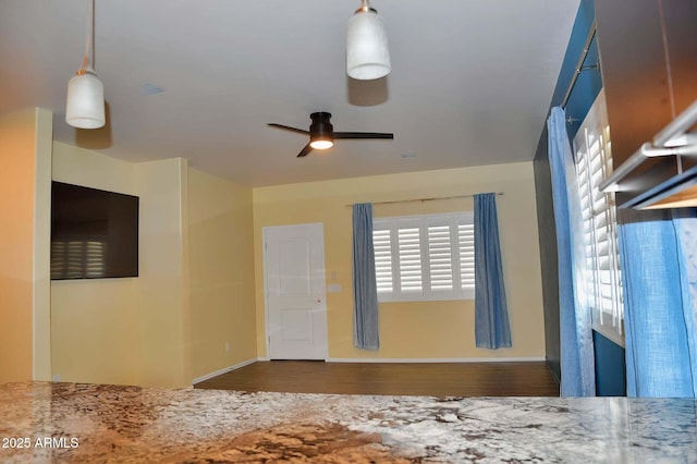 728 S Meadowood Ln, Sierra Vista, AZ 85635 - unfurnished living room featuring ceiling fan, baseboards, and wood finished floors