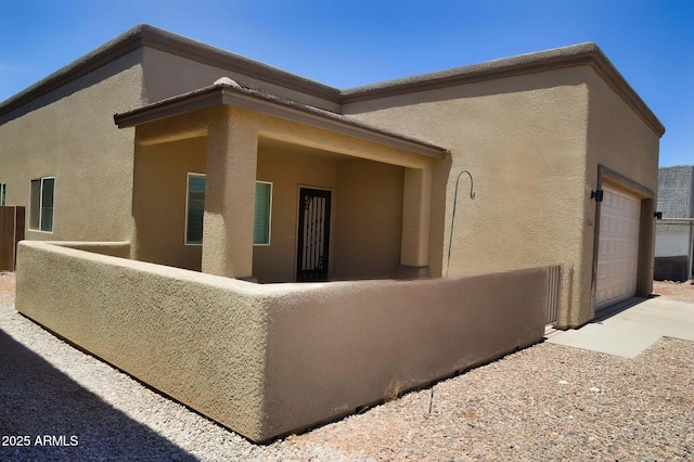 728 S Meadowood Ln, Sierra Vista, AZ 85635 - view of home's exterior featuring stucco siding, an attached garage, and driveway