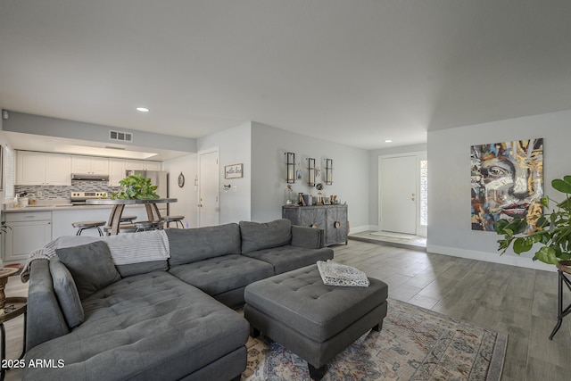 living room with light hardwood / wood-style floors