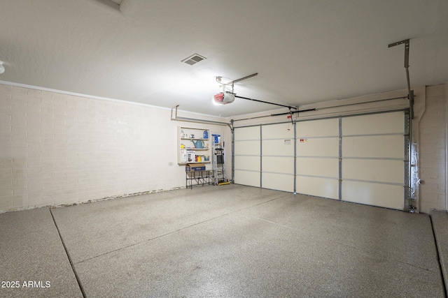 garage featuring a garage door opener