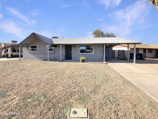 single story home featuring a carport