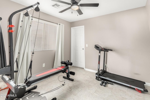 exercise room with ceiling fan, visible vents, and baseboards