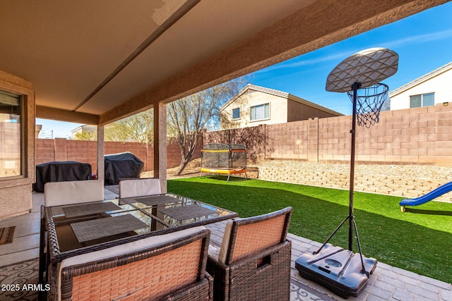 view of patio / terrace featuring a fenced backyard, a grill, and an outdoor living space