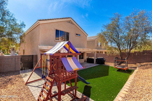 view of play area featuring a fenced backyard and a yard