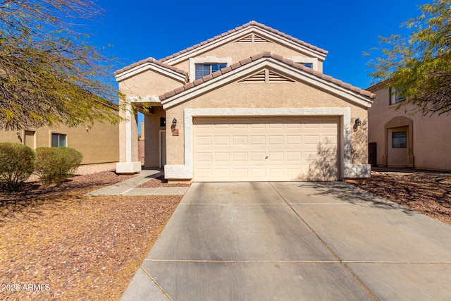 view of front of home featuring a garage, concrete driveway, a tile roof, and stucco siding