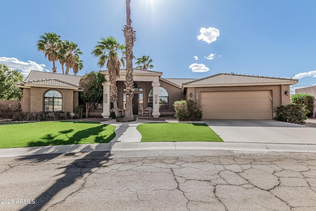 1207 E Clearview Dr, Casa Grande, AZ 85122 - mediterranean / spanish house with a front yard, stucco siding, an attached garage, driveway, and a tile roof
