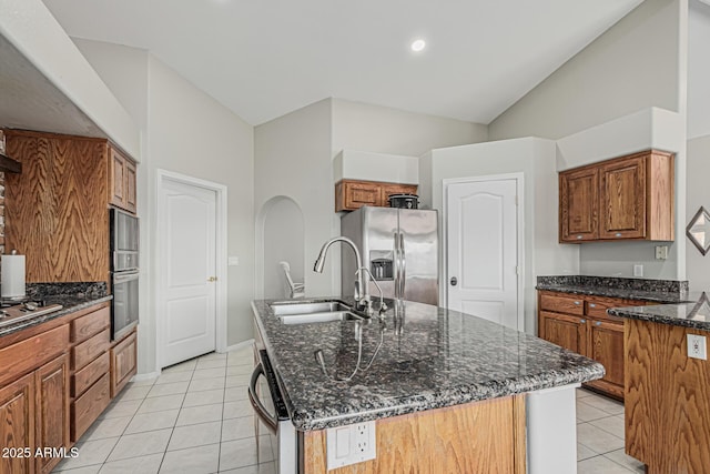 1207 E Clearview Dr, Casa Grande, AZ 85122 - kitchen with appliances with stainless steel finishes, a sink, an island with sink, dark stone countertops, and light tile patterned floors