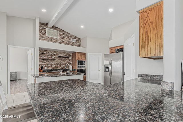 1207 E Clearview Dr, Casa Grande, AZ 85122 - unfurnished living room with visible vents, beam ceiling, brick wall, high vaulted ceiling, and a sink