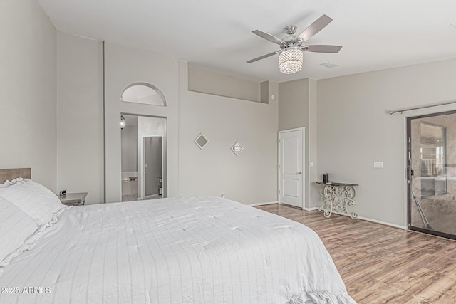 1207 E Clearview Dr, Casa Grande, AZ 85122 - bedroom featuring baseboards, a ceiling fan, wood finished floors, and a towering ceiling