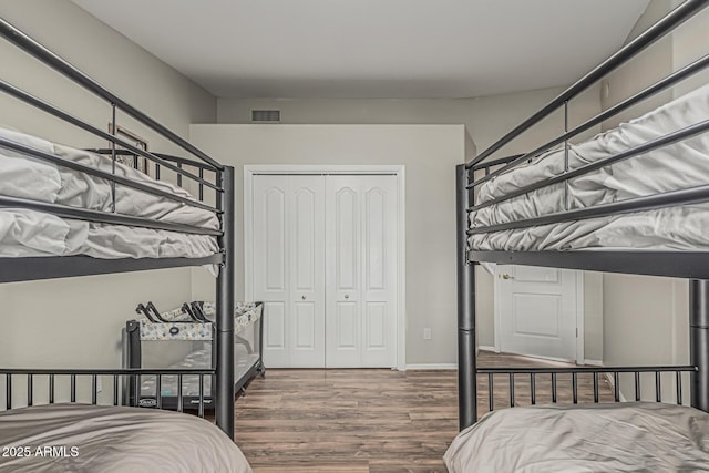 1207 E Clearview Dr, Casa Grande, AZ 85122 - bedroom featuring a closet, wood finished floors, and visible vents