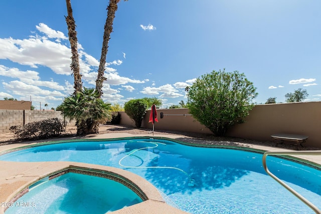 1207 E Clearview Dr, Casa Grande, AZ 85122 - view of pool with a fenced backyard, a fenced in pool, and an in ground hot tub