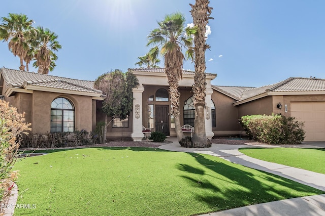 1207 E Clearview Dr, Casa Grande, AZ 85122 - mediterranean / spanish house featuring stucco siding, an attached garage, and a tile roof