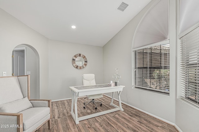 1207 E Clearview Dr, Casa Grande, AZ 85122 - office space featuring visible vents, wood finished floors, baseboards, recessed lighting, and arched walkways
