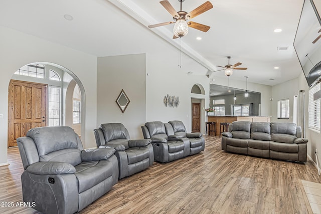 1207 E Clearview Dr, Casa Grande, AZ 85122 - living area featuring visible vents, arched walkways, light wood-style flooring, and ceiling fan