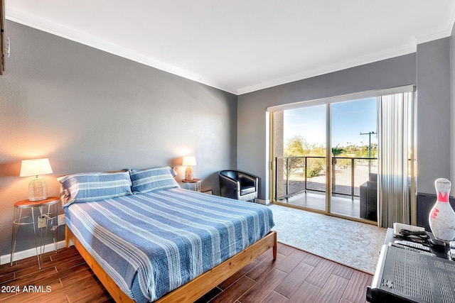 bedroom with crown molding and access to outside