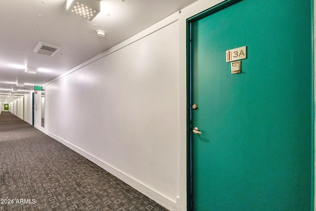 corridor featuring carpet floors