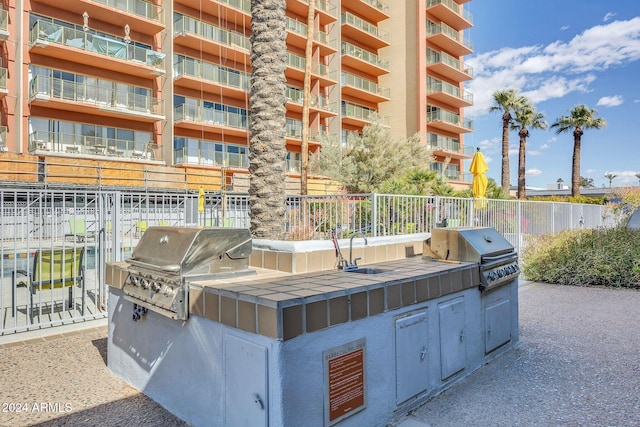 view of patio with area for grilling and exterior kitchen