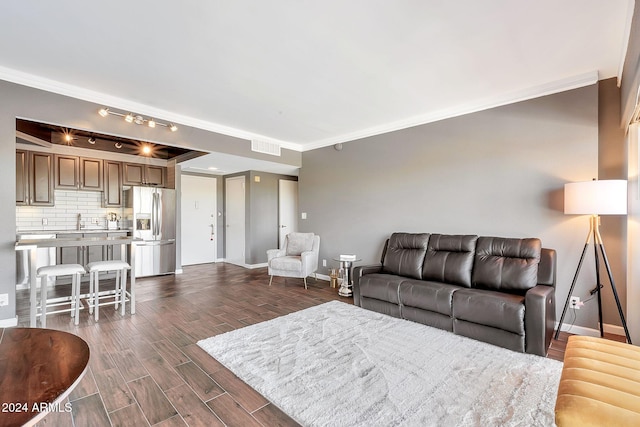 living room featuring crown molding