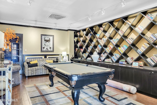 recreation room featuring rail lighting, wood-type flooring, and billiards