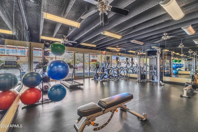 exercise room with ceiling fan