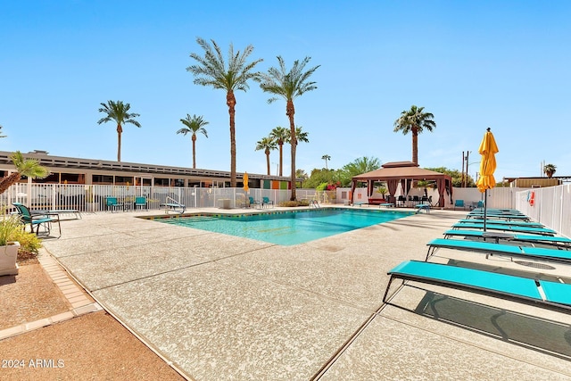 view of swimming pool with a gazebo and a patio