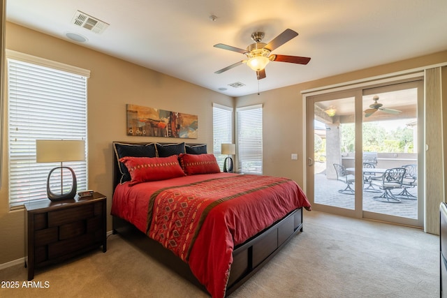 bedroom featuring visible vents, light colored carpet, ceiling fan, and access to outside