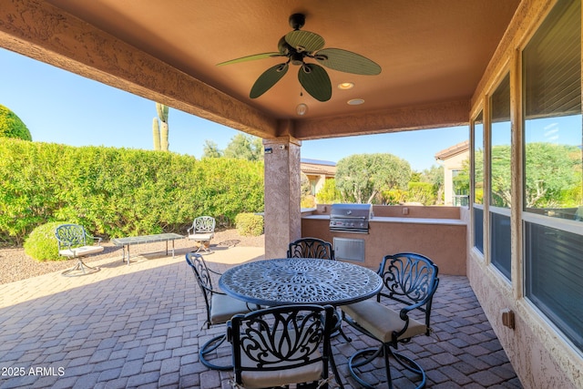 view of patio / terrace featuring outdoor dining space, area for grilling, and ceiling fan