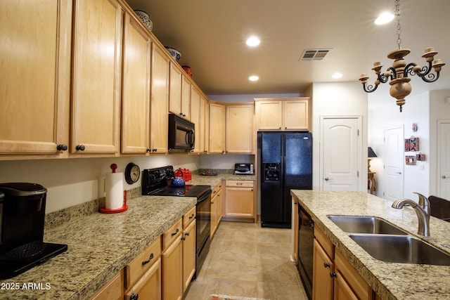 kitchen featuring light brown cabinets, visible vents, recessed lighting, a sink, and black appliances