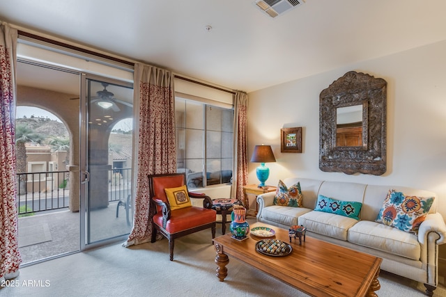 carpeted living area with visible vents