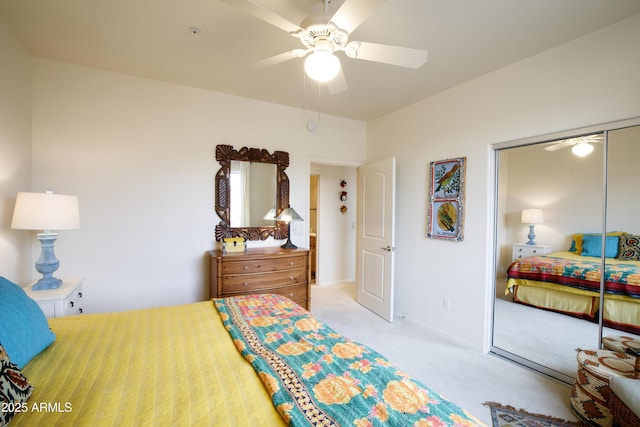 carpeted bedroom with a closet and ceiling fan