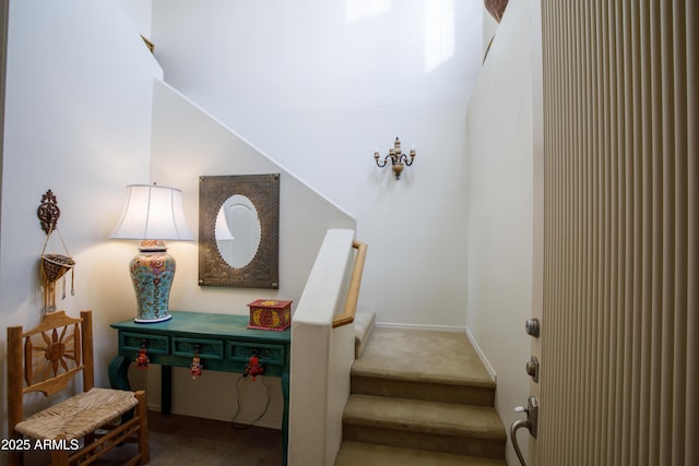 staircase with carpet flooring and baseboards