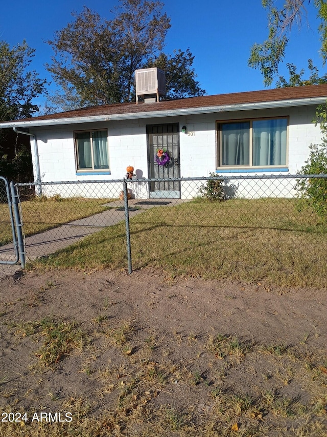 single story home with a front lawn and central AC