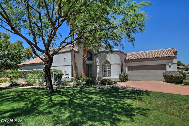 8120 E Cortez Dr, Scottsdale, AZ 85260 - mediterranean / spanish home with an attached garage, a tiled roof, a front yard, stucco siding, and concrete driveway