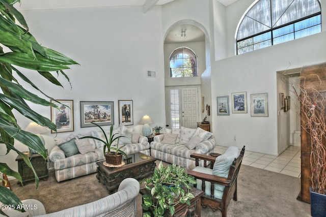 8120 E Cortez Dr, Scottsdale, AZ 85260 - tiled living room with a high ceiling, carpet, and arched walkways