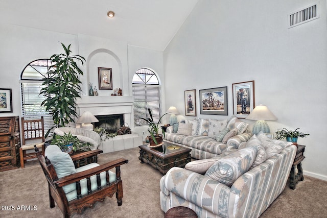 8120 E Cortez Dr, Scottsdale, AZ 85260 - living area with carpet floors, high vaulted ceiling, and a fireplace with raised hearth