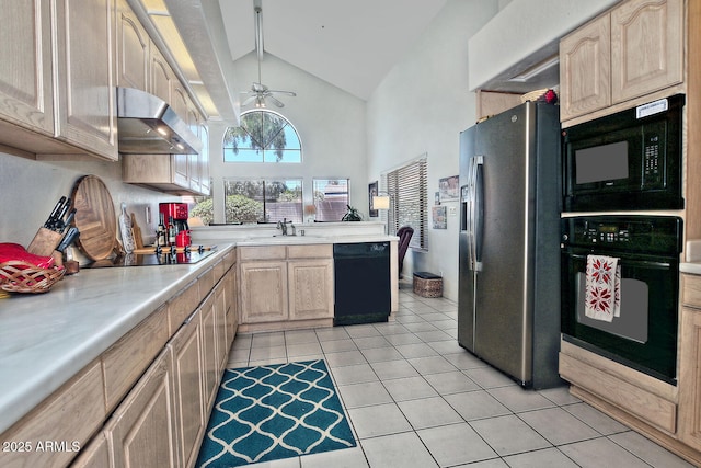 8120 E Cortez Dr, Scottsdale, AZ 85260 - kitchen with black appliances, under cabinet range hood, light brown cabinetry, light countertops, and high vaulted ceiling