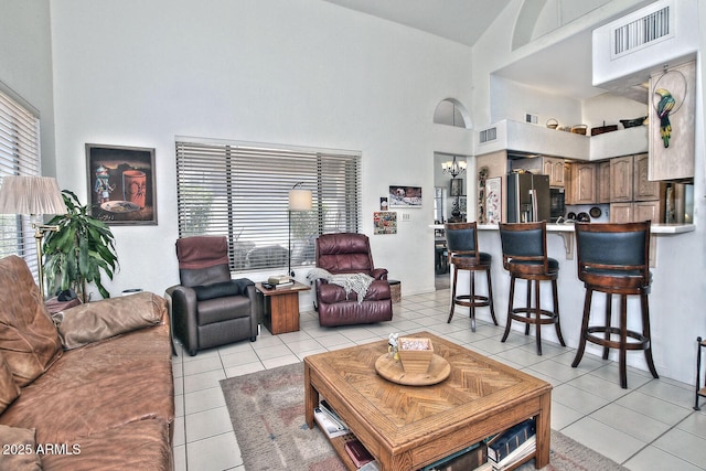 8120 E Cortez Dr, Scottsdale, AZ 85260 - living area with a high ceiling, light tile patterned flooring, plenty of natural light, and a chandelier