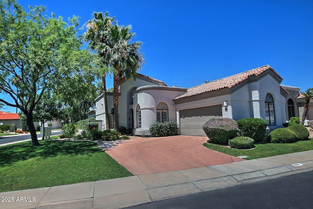 8120 E Cortez Dr, Scottsdale, AZ 85260 - mediterranean / spanish house with a tiled roof, stucco siding, a front yard, a garage, and driveway
