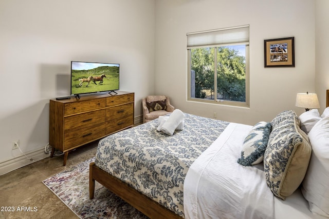 bedroom with concrete floors