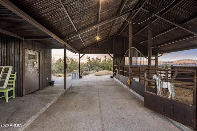 view of stable featuring a mountain view