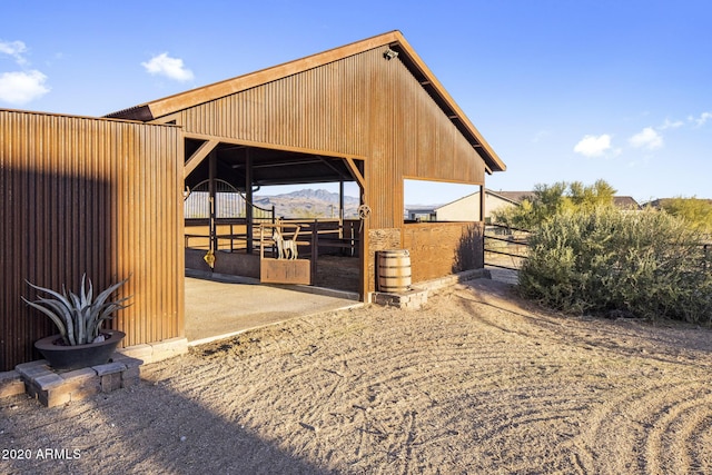 exterior space featuring a mountain view and an outdoor structure
