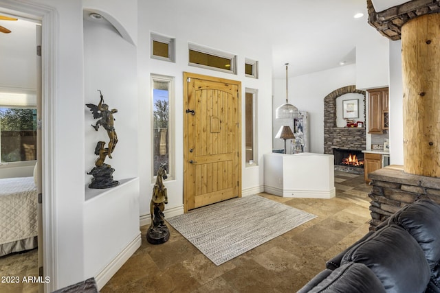 foyer entrance with ceiling fan