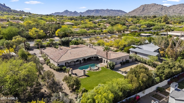 birds eye view of property with a mountain view