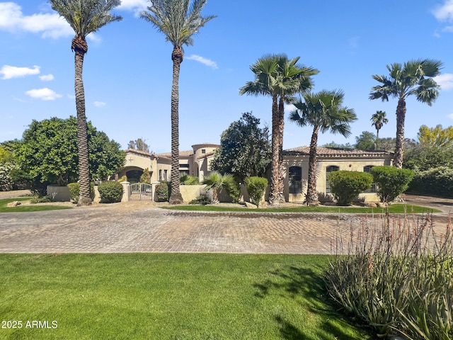 surrounding community featuring a lawn, a gate, and fence