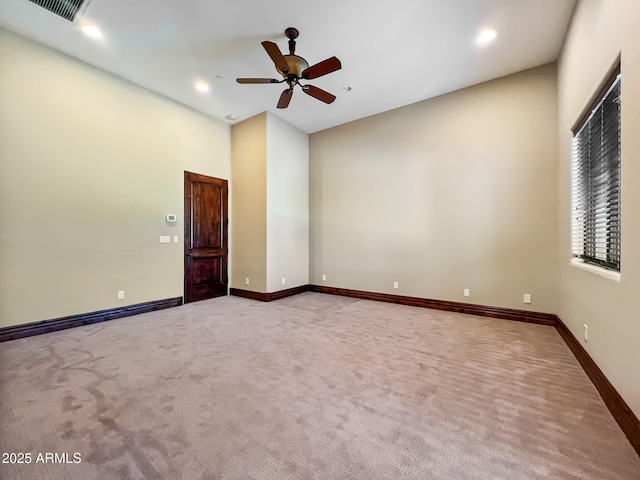 carpeted spare room featuring visible vents, recessed lighting, baseboards, and ceiling fan
